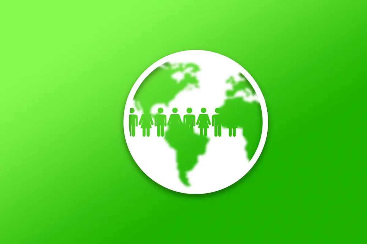 A white globe with a row of people silhouettes across it on a bright green background